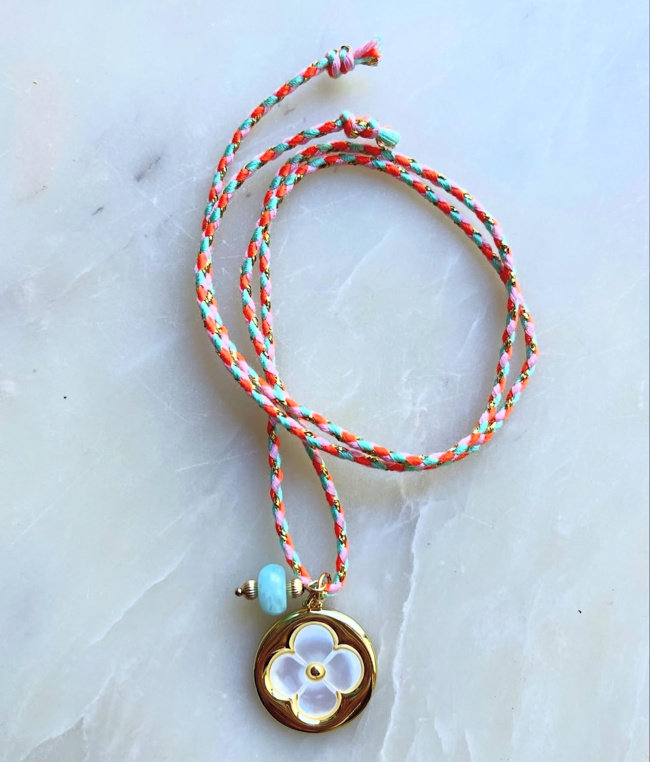 Gold flower tie on Necklace