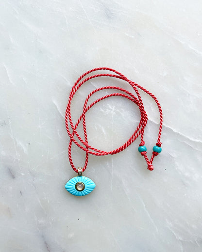 Carved Eye Tie on Necklace